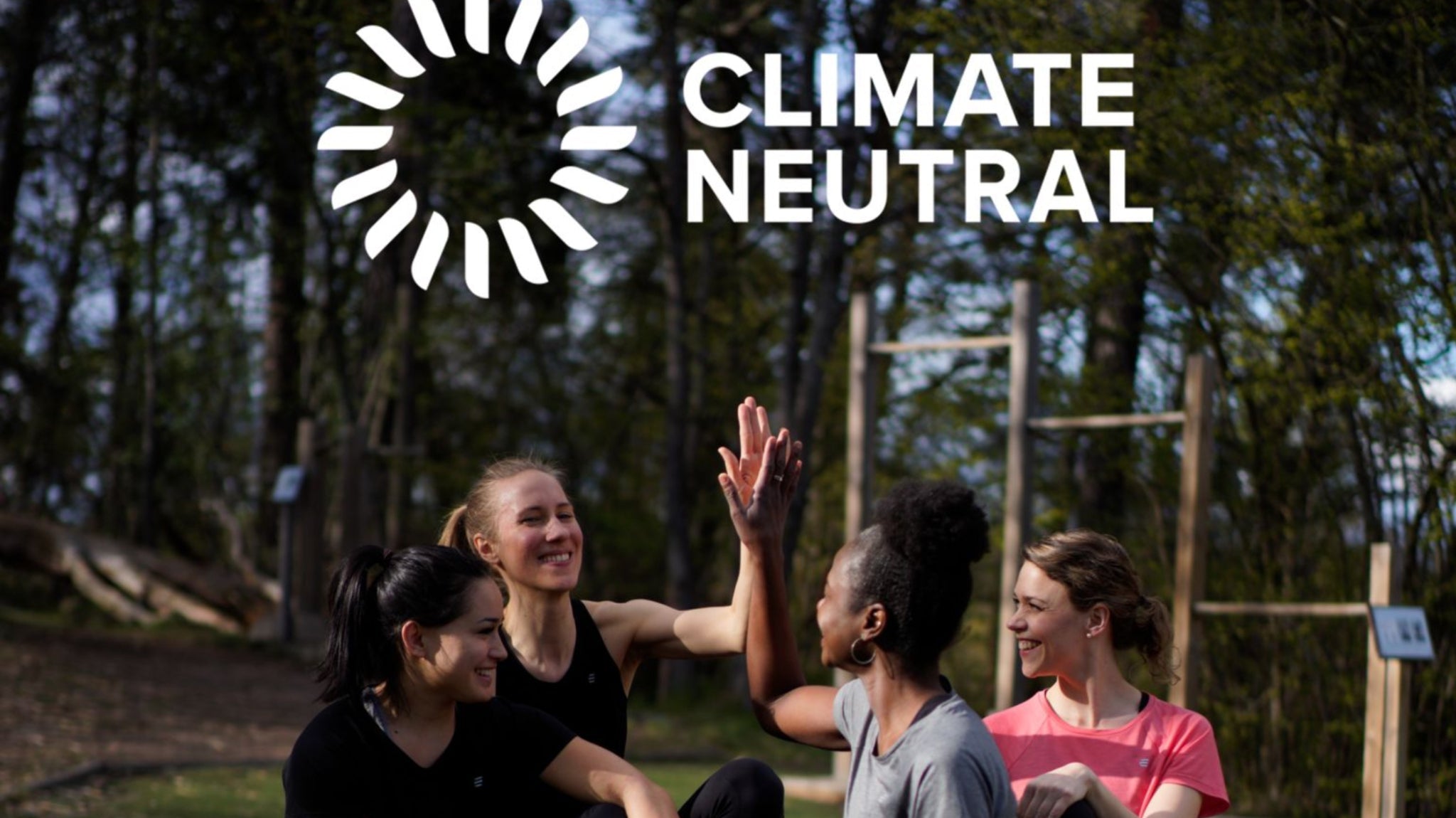 Women training outdoors with a Climate Neutral logo overlay.