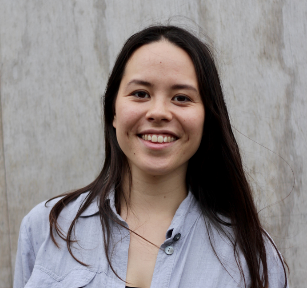 Portrait of Lili, founder of Vaer Upcycled, smiling in a light shirt.