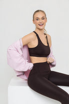 Woman wearing Pro Tencel Leggings and Sports Bra in Terra Brown 
