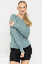 woman wearing tencel long-sleeve shirt in eucalyptus green